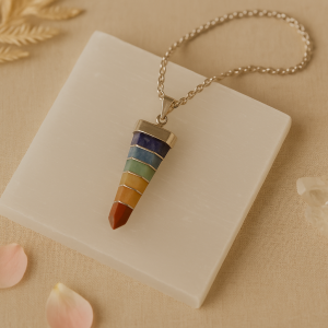 7 chakra crystal pendant displayed on a selenite plate with healing stones – handcrafted by Vedoorja Jaipur